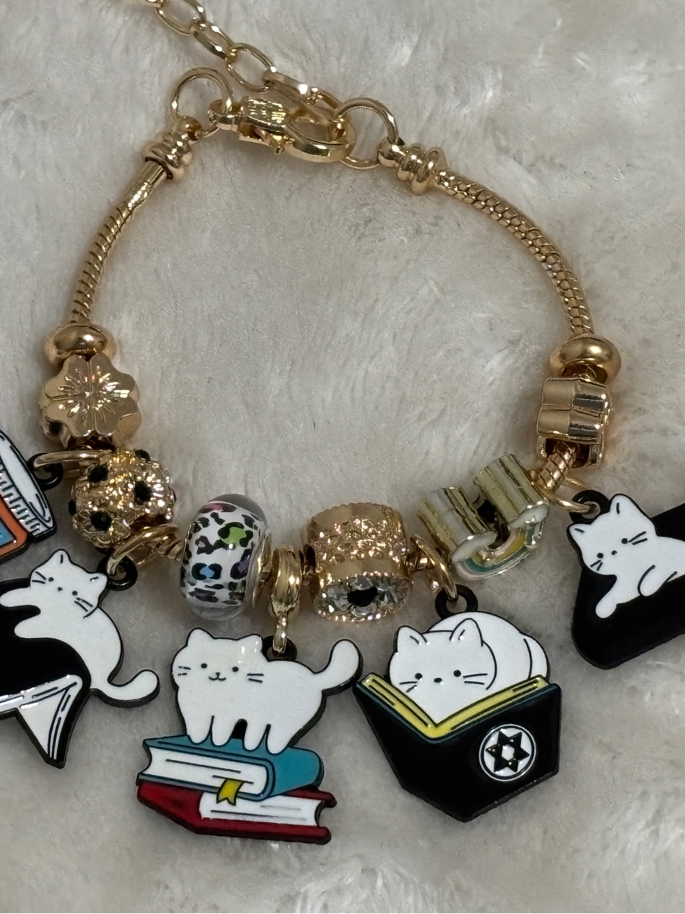 Gold-Tone Cat Charm Bracelet with White & Black Accents